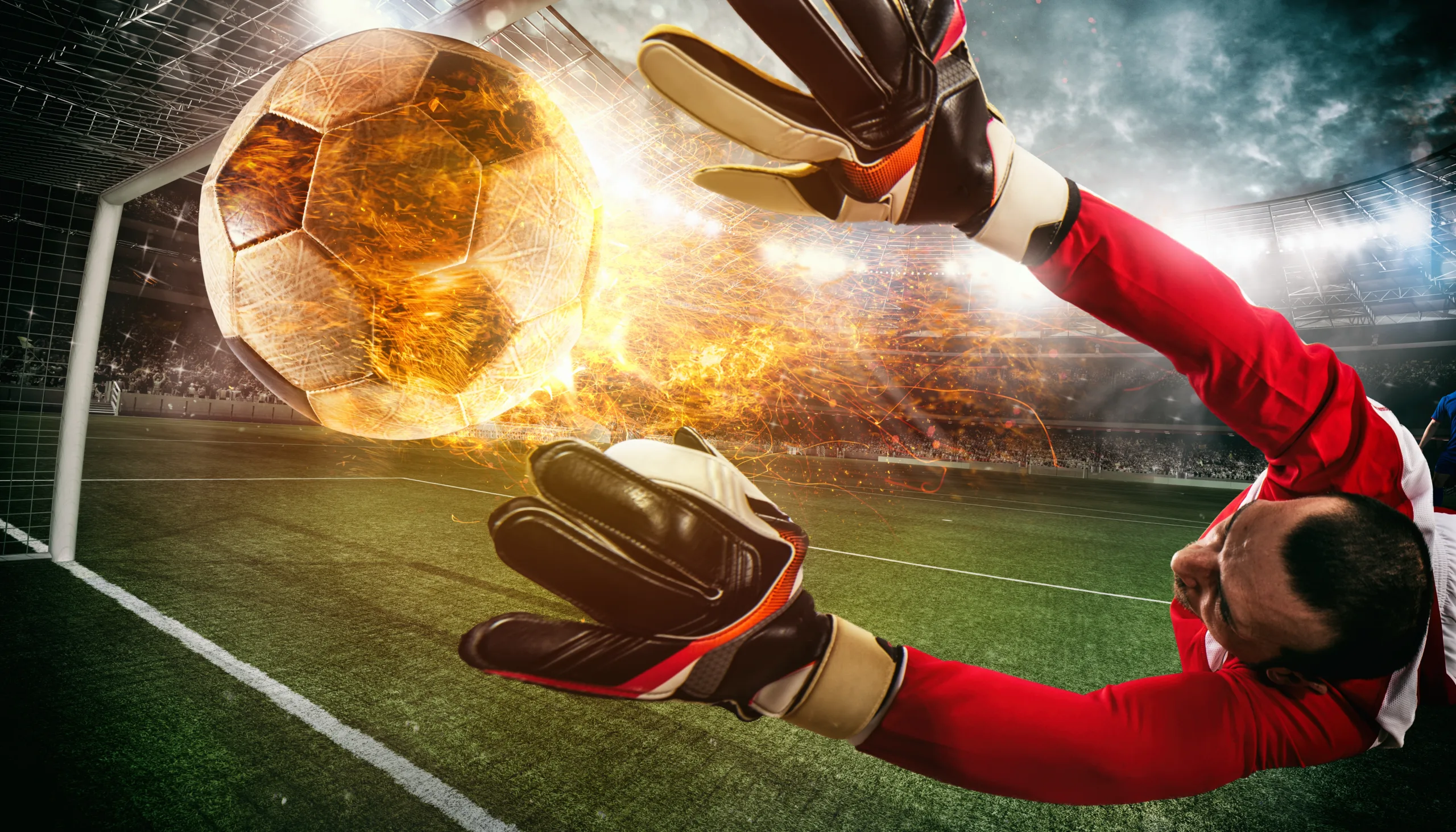 Goalkeeper diving towards the ball